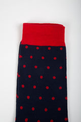 Chaussettes marine à pois rouges