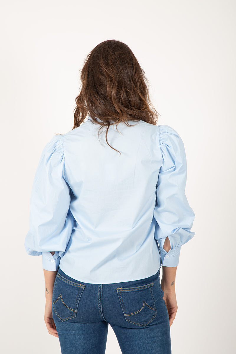 Blusa abullonada celeste